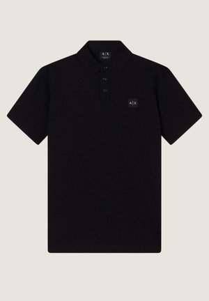 Black short-sleeve polo shirt with three-button placket and small A|X logo patch on the left chest.