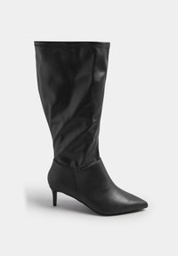 Zwarte kniehoge laars van glad synthetisch materiaal, met een puntige neus, een slouchy schachtontwerp en een korte hak.