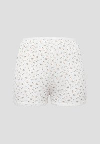 Shorts en coton blanc avec petit imprimé floral et bordure en dentelle le long de l'ourlet, présentés sur un fond uni.