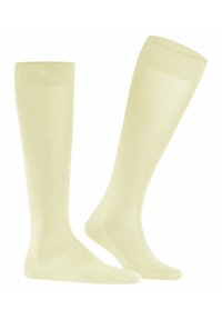 Helle gelbe knielange Socken aus glattem Material mit einem gerippten Bund. Sie haben ein einfaches Design ohne Muster oder Akzente.