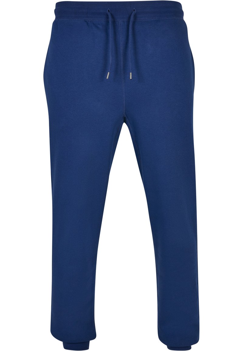 Pantaloni de trening bleumarin din bumbac moale. Prezentază un elastic la talie cu șnur, buzunare laterale și manșete ribotate la glezne.