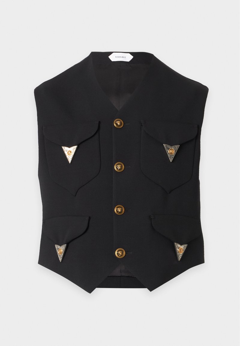 Gilet noir avec quatre boutons dorés et quatre poches à rabat, chacune décorée de détails métalliques triangulaires avec un emblème doré.