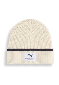 Beanie in maglia crema con texture a coste, dotato di una fascia blu navy e di un'etichetta bianca con dettagli del logo in nero. Realizzato in materiale caldo e morbido.