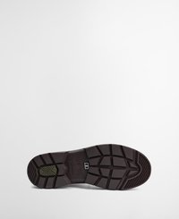 Sole de sapato de borracha castanho com padrão de rasto profundo, apresentando um detalhe verde e o logotipo da marca. O design inclui uma área de calcanhar acolchoada.