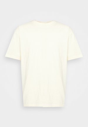Cream-colored short-sleeve T-shirt with a round neck, made of soft fabric, featuring a simple, smooth texture and no visible graphics or embellishments.