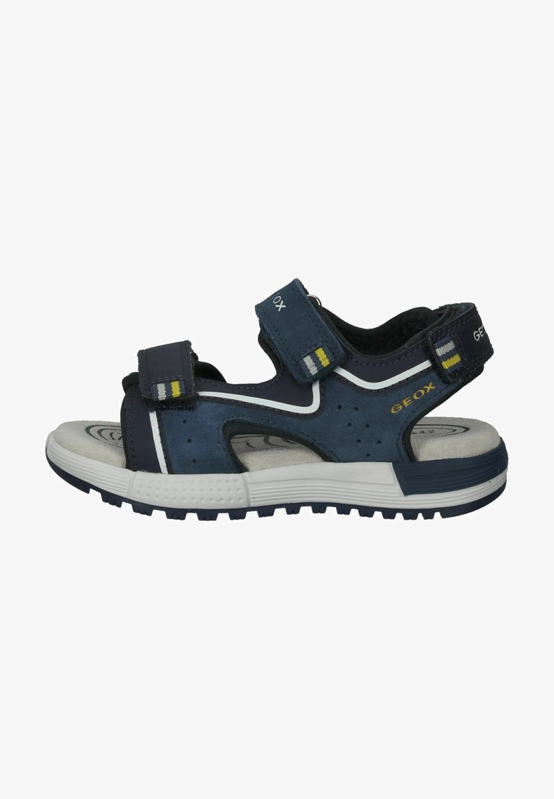 Sandalia azul y negra con dos correas de velcro, parte superior perforada para transpirabilidad, suela de goma y acentos blancos. Logo de Geox en el lateral.
