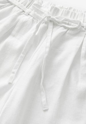Weiße Leinenhose mit einem elastischen Bund und passendem Kordelzug sowie einem weichen, strukturierten Stoff für Komfort und Atmungsaktivität.