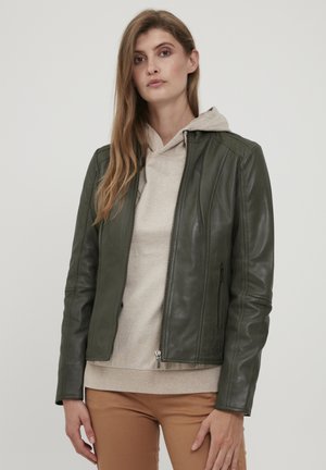 Olive green leather jacket with fitted design, zip closure, and side pockets, layered over a beige hoodie. Smooth texture with minimal detailing.