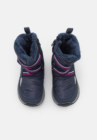 Navy winter boots with soft faux fur lining, featuring pink and white strap accents, side zippers, and a textured rubber sole.