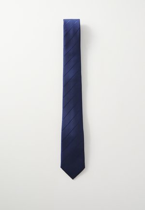 Cravate marine en tissu lisse, ornée de rayures diagonales, avec une extrémité effilée et un léger éclat. Mesure environ 145 cm de long.