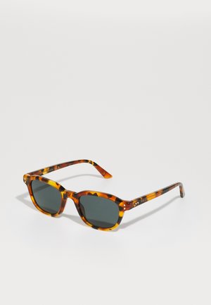 Tortoiseshell sunglasses with green lenses, rectangular frame, and metallic accents on arms. Made of lightweight plastic.
