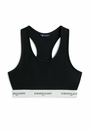 Top deportivo negro con espalda racerback y banda elástica blanca con el texto "tommyjeans" en fuente cursiva negra.
