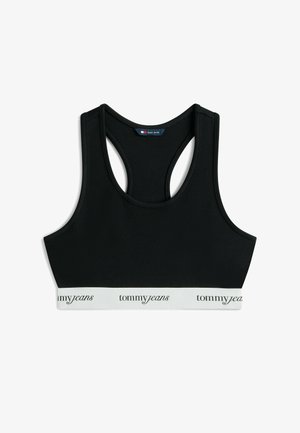 Zwart racerback sportbeha met een witte elastische band met daarop de tekst "tommyjeans" in zwart cursief lettertype.
