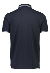 Polo shirt marine à manches courtes, en tissu texturé. Rayures d'accent en bleu clair sur le col et les ourlets des manches.