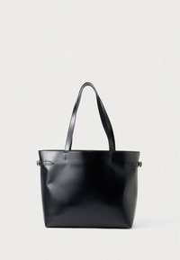 Black leather tote bag with two handles, a smooth texture, minimalistic design, and a single strap accent on each side.