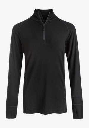 Sort langærmet pullover med en kvart-lynlås krave, som har fladjernssømme og en let, glat tekstur.