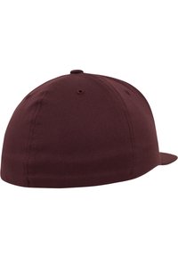 Maroon baseball cap featuring a rounded crown, flat brim, and stitched ventilation holes. Made from durable cotton fabric with a smooth texture.