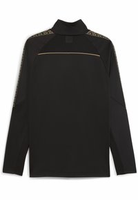 Svart långärmad skjorta med hög krage, med nätpaneler på axlarna och ett guld geometriskt mönster längs axelpartiet.