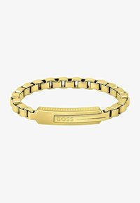 Seleccionado, gold-coloured