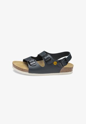 Schwarze Sandale mit zwei verstellbaren Riemen und Metall-Schnallen, Korkfußbett und Gummi-Laufsohle, mit einer glatten matten Oberfläche.