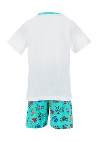 White cotton t-shirt with a turquoise collar paired with turquoise shorts featuring colorful superhero graphics and an elastic waistband.