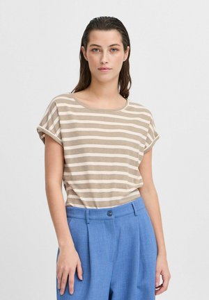 Striped t-shirt in beige and cream, with short rolled sleeves and a wide neckline, paired with light blue tailored trousers.
