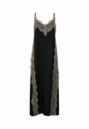 Robe nuisette en soie noire avec bordure en dentelle beige le long du décolleté et sur les côtés, dotée de fines bretelles réglables.