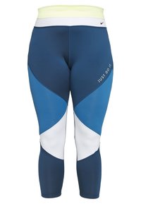 Granatowe legginsy sportowe z kontrastowymi panelami geometrycznymi w jasnym i ciemnym niebieskim, z białym pasem w talii i napisem „JUST DO IT”.}}}]}