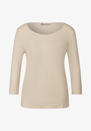 Beige Langarmoberteil mit einem runden Ausschnitt. Hergestellt aus einem glatten, dehnbaren Stoff. Verfügt über ein schlichteres Design und einen geraden Saum.