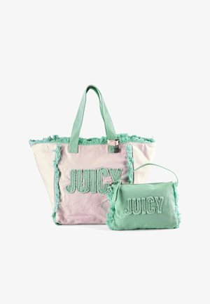Two pastel tote bags with fringe edges, one pink and one green, both featuring the word "JUICY" in large textured letters.