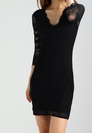 Black dress with a scalloped neckline, three-quarter lace sleeves, and a fitted silhouette featuring textured wave patterns.