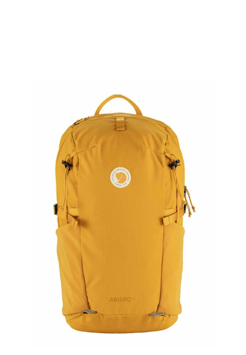 Gelbe Rucksack mit strukturierten Oberflächen, Tragegriff oben und Logo-Patch. Verfügt über seitliche Kompressionsgurte und Reißverschlussverschlüsse für sicheren Stauraum.