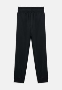 Zwarte sportieve broek met een elastische tailleband, taps toelopende pijpen en een zachte, gladde stof. Boorden bij de enkels maken het ontwerp compleet.