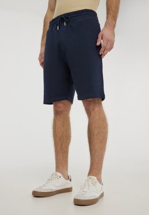 - Spodnie treningowe