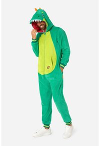Tutina in pile verde con design di un dinosauro, cappuccio, punte arancioni, rivestimento a fantasia rossa e tasca frontale.