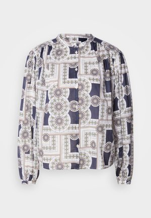Gemusterte Bluse mit Rundhalsausschnitt, langen Puffärmeln und Knopfverschluss, die geometrische Designs in Marineblau, Weiß und Grün zeigt.