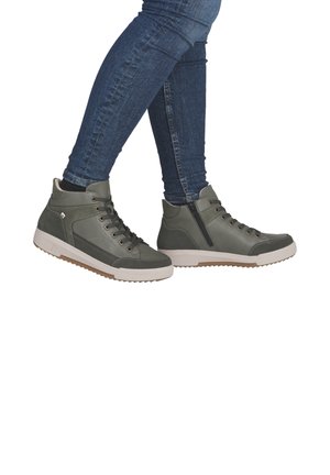 High-top sneakers made of dark green leather with white rubber soles and contrasting light brown accents, featuring laces and a zip closure.