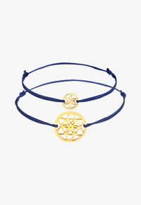 Seleccionado, gold-coloured