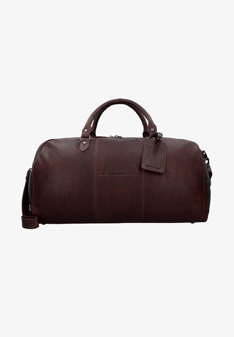 Sac de voyage en cuir marron avec poignées arrondies, fermeture éclair et bandoulière amovible. Présente un logo embossé et un porte-étiquette.