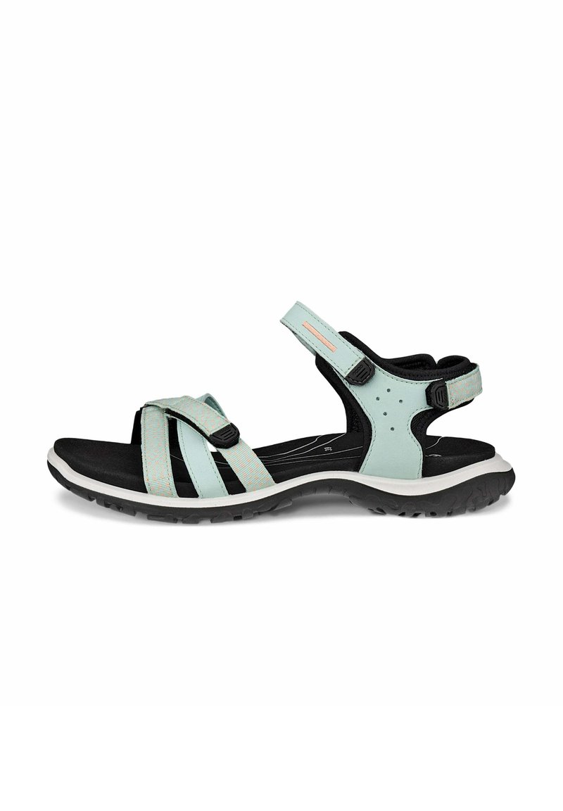 Sport sandal featuring a light blue upper with black accents, adjustable straps, cushioned sole, and a textured rubber outsole.