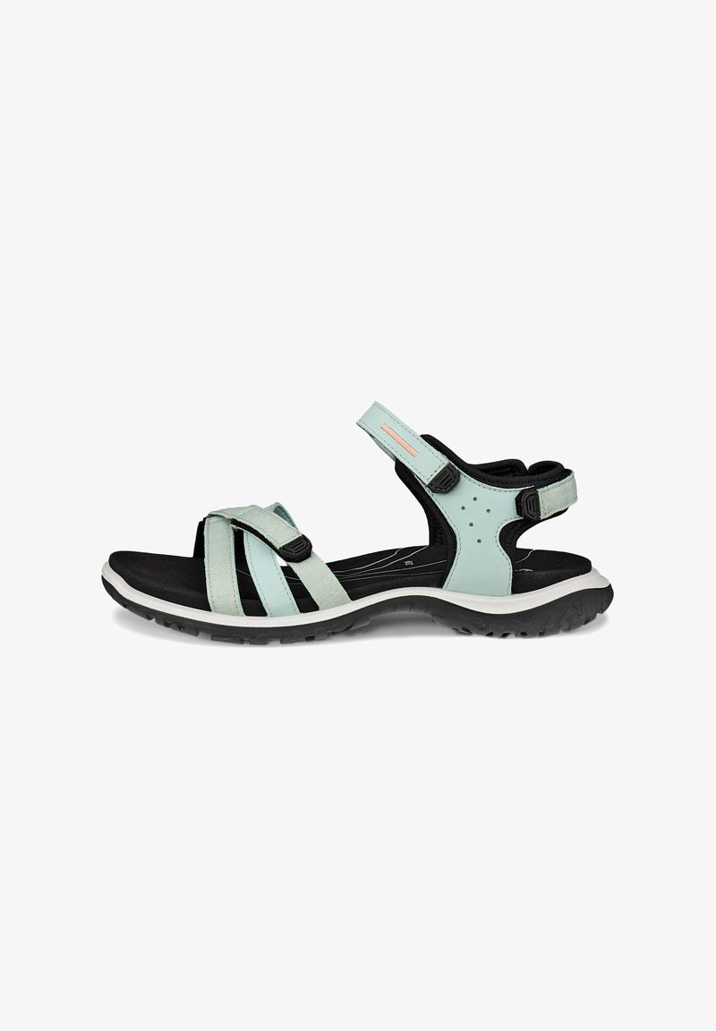 Sport sandal featuring a light blue upper with black accents, adjustable straps, cushioned sole, and a textured rubber outsole.