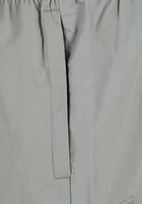 Light gray, textured cargo shorts featuring an elastic waistband, straight leg cut, and side pocket with clean stitching detail.