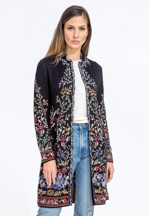 Long black cardigan featuring colorful floral embroidery, a front opening, and intricate border designs, made from soft fabric with a smooth texture.