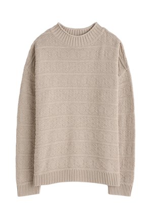 Pulover bej tricotat cu un model texturat și guler și tiv ribbed. Croială lejeră și umeri lăsați. Material moale, formă fără constrângeri.