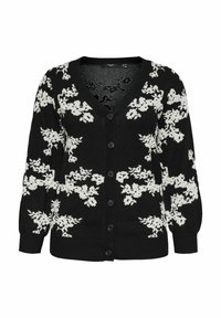 Cardigan noir avec motif floral blanc, en V, boutons sur le devant, et manches longues avec des poignets côtelés. Texture douce et coupe décontractée.