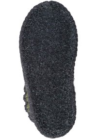 Schwarze, strukturierte Sohle eines Schuhs mit einer flauschigen Oberfläche, abgerundeter Form und leichter Wölbung an den Rändern, die Komfort und Halt signalisiert.