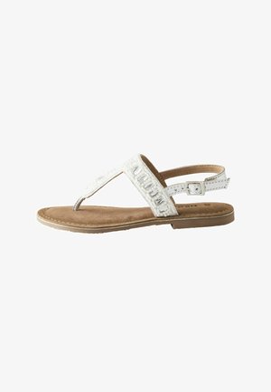 Hvid perleet thong sandal med justerbar ankelrem og brun polstret sål vist fra siden på hvid baggrund.