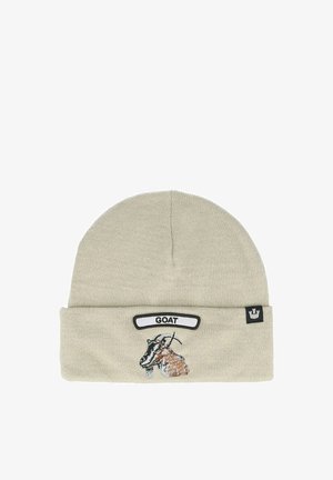 Strickmütze in hellem Beige mit umgeschlagenem Saum, ausgestattet mit einer gestickten Ziegenillustration und einem Etikett mit der Aufschrift "GOAT". Weicher Stoff.