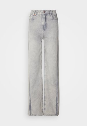 Lyseblå vid-leg jeans lavet af denim med en falmet vask, der har lynlås, fem lommer og kontraststikning.