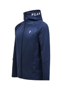 Chaqueta de cremallera azul marino con cuello alto, presenta el logo "PEAK" en la capucha, bolsillos laterales y una tela suave y texturada.